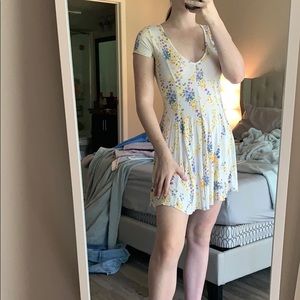 A light floral white dress with a cinch waist